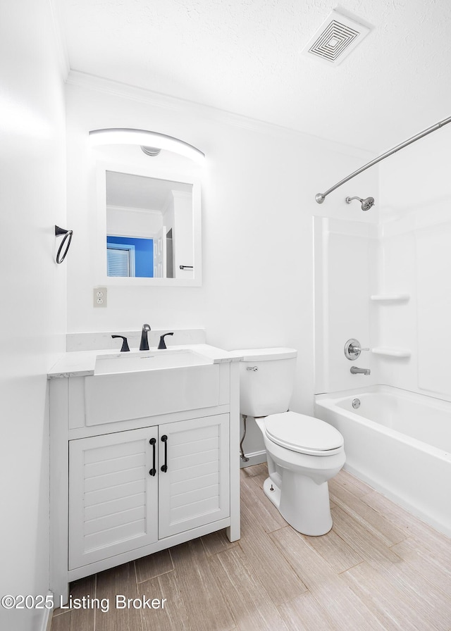 full bathroom with toilet, vanity, bathtub / shower combination, and hardwood / wood-style flooring