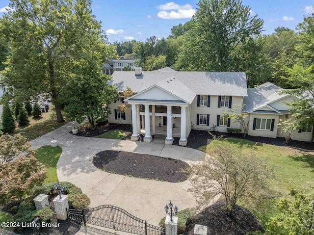 view of front of house featuring a fenced front yard, a gate, and a front yard