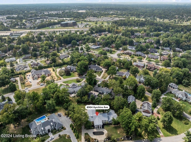 birds eye view of property with a residential view