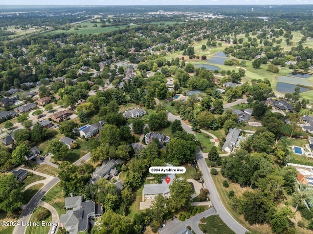 aerial view featuring a water view, a residential view, and golf course view