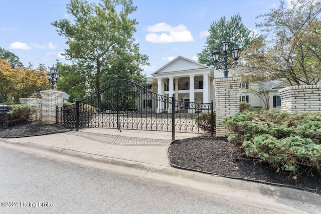 view of gate featuring fence