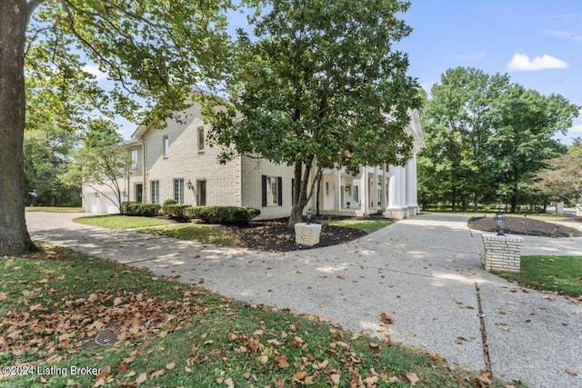 view of front of property featuring brick siding