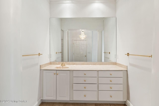 bathroom with vanity and baseboards