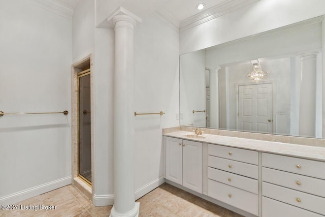 bathroom featuring ornamental molding, a stall shower, vanity, and ornate columns