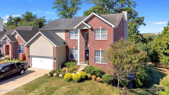 view of front of house with a garage and a front lawn