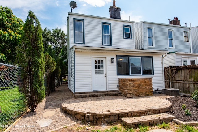 back of house with a patio area