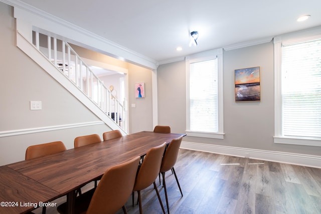 dining room featuring crown molding and hardwood / wood-style floors