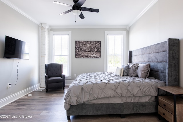 bedroom with ceiling fan, ornamental molding, hardwood / wood-style floors, and multiple windows