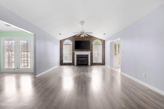 unfurnished living room with a large fireplace, ceiling fan, hardwood / wood-style floors, and vaulted ceiling