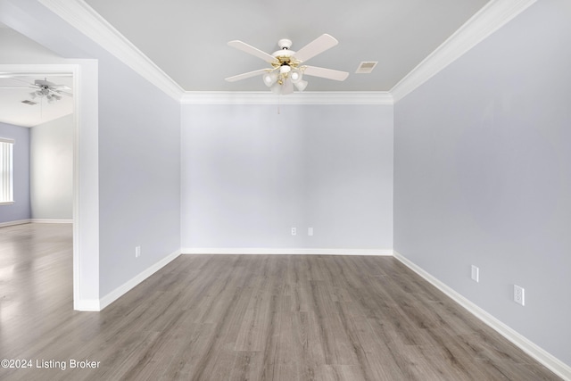 unfurnished room with hardwood / wood-style floors, ceiling fan, and ornamental molding