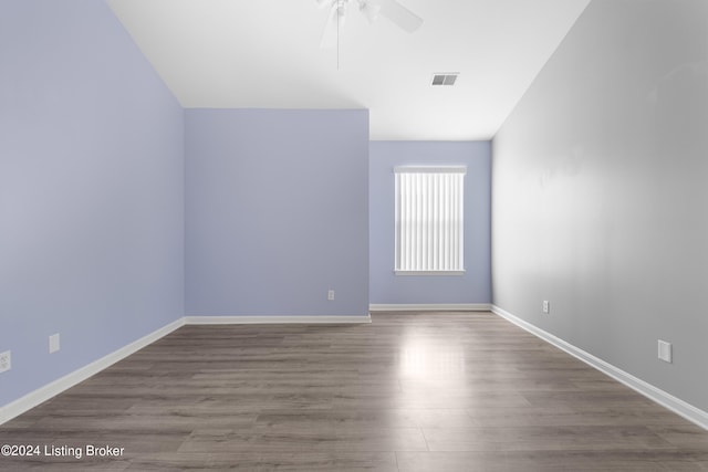 unfurnished room with light wood-type flooring and ceiling fan