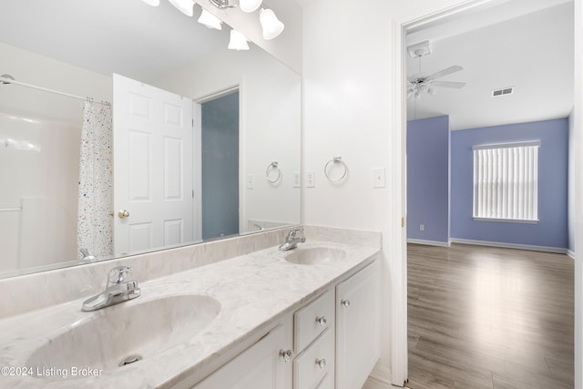 bathroom featuring vanity, ceiling fan, curtained shower, and hardwood / wood-style flooring