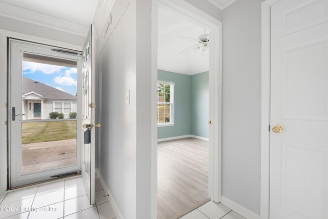 interior space with crown molding and ceiling fan