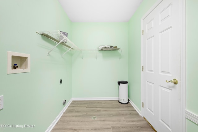 laundry area featuring light wood-type flooring, hookup for a washing machine, and hookup for an electric dryer