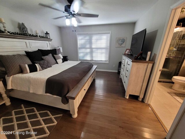 bedroom with ceiling fan, dark hardwood / wood-style floors, and ensuite bathroom