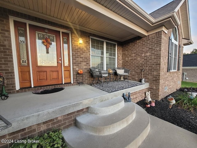 property entrance with covered porch