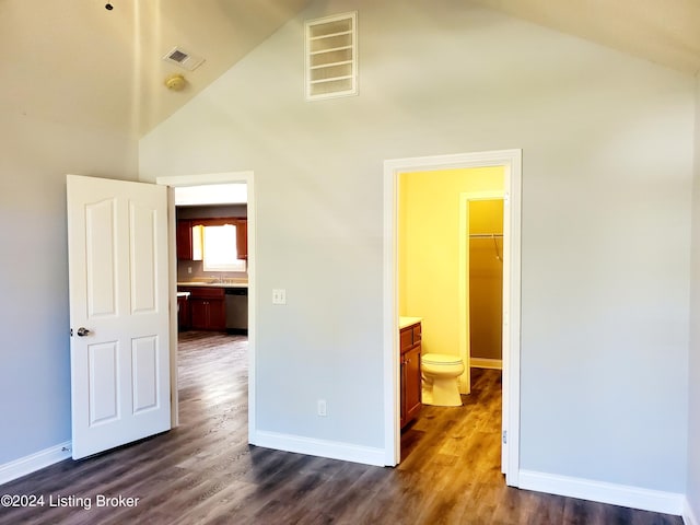 unfurnished bedroom with dark wood finished floors and baseboards