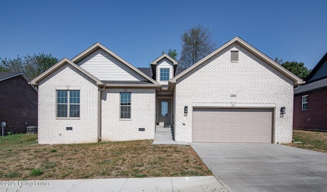 view of front of property featuring cooling unit and a garage