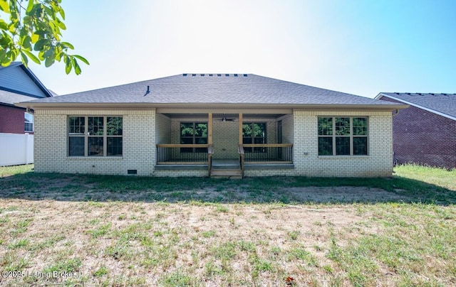 rear view of house with a lawn