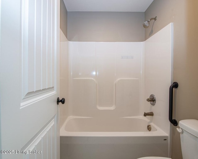 bathroom with toilet and shower / bath combination