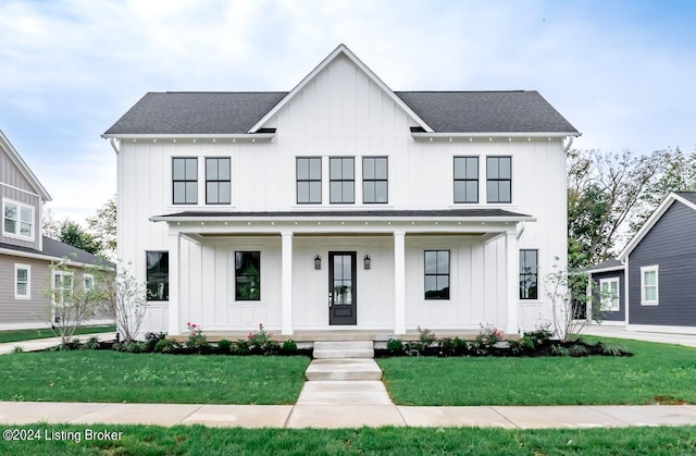 modern inspired farmhouse featuring a front yard and a porch