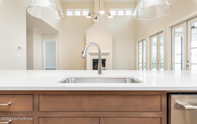 kitchen with french doors, sink, and a healthy amount of sunlight