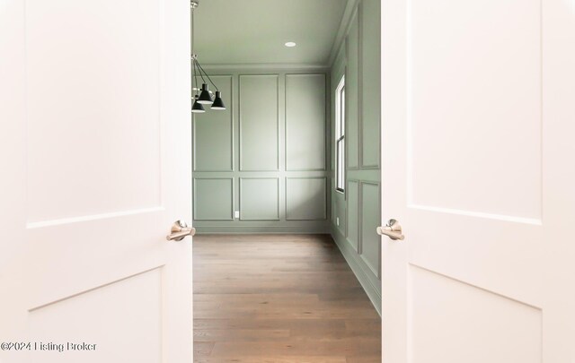 walk in closet with light hardwood / wood-style flooring