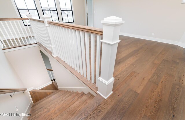 stairway featuring hardwood / wood-style flooring