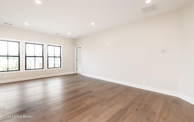 unfurnished room featuring wood-type flooring