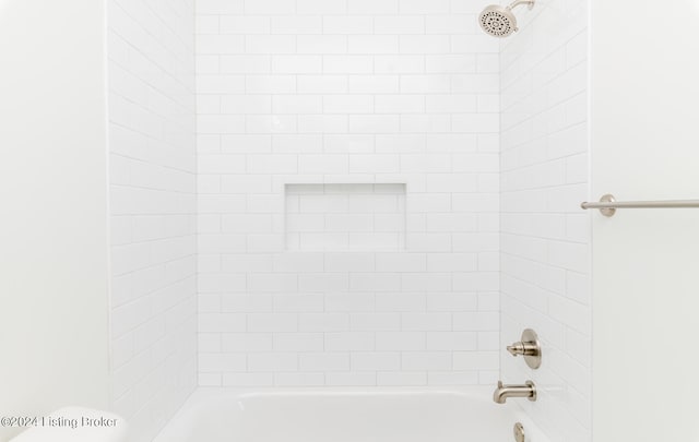 interior space with tiled shower / bath combo