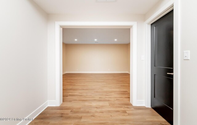 hall with light wood-type flooring