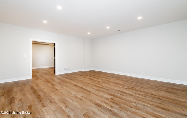 empty room with light hardwood / wood-style floors