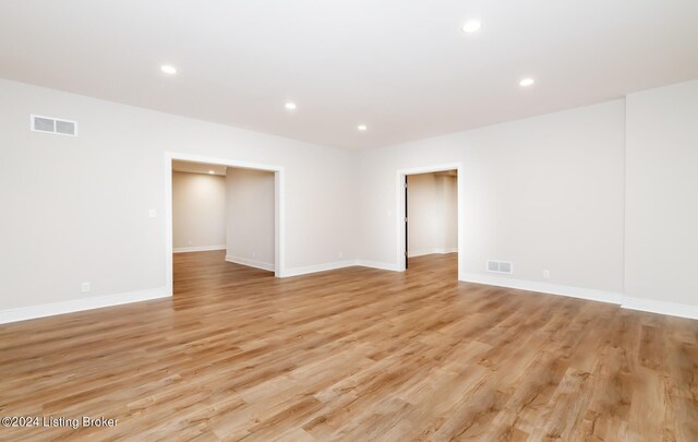 spare room featuring light hardwood / wood-style floors