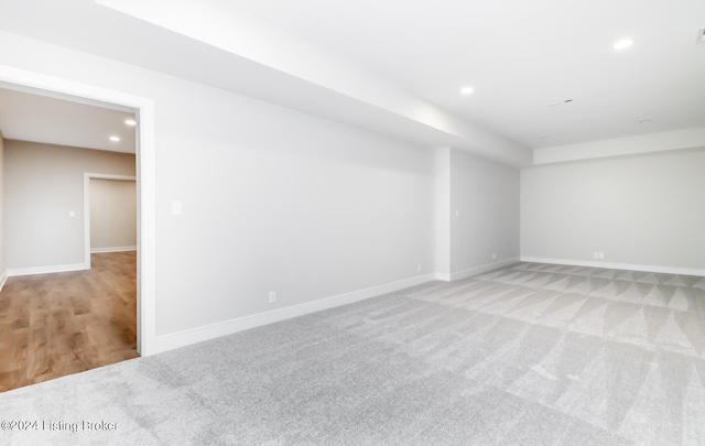 spare room with light colored carpet