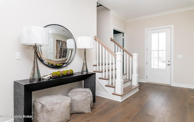 entryway featuring crown molding and dark hardwood / wood-style floors