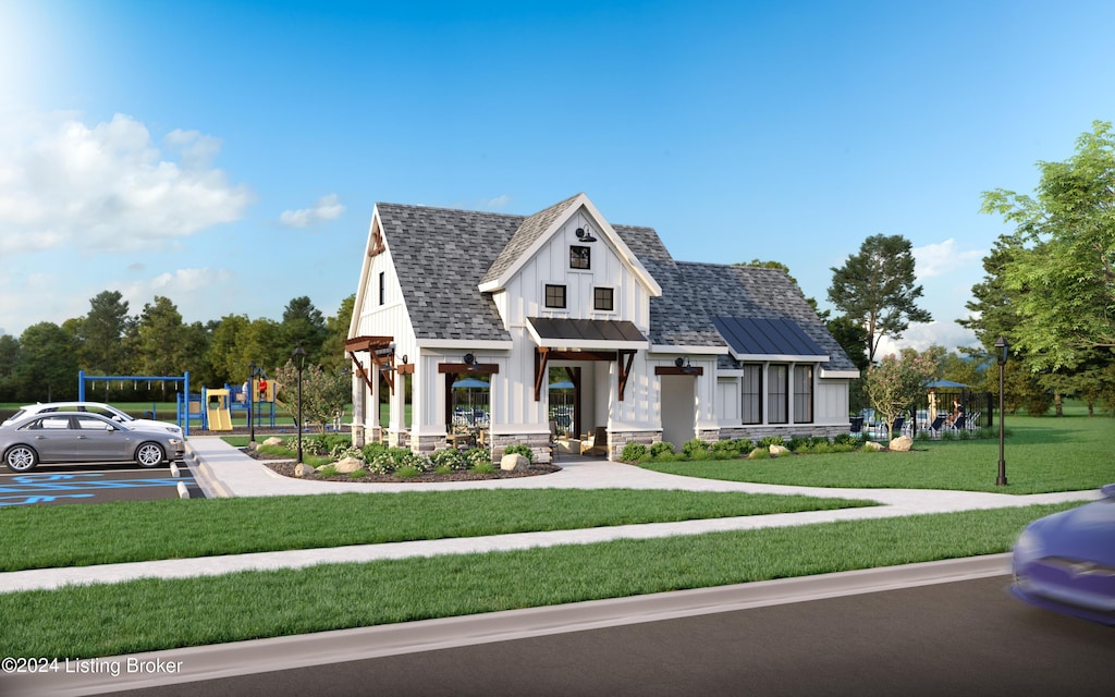 modern farmhouse style home with playground community, roof with shingles, a standing seam roof, a front lawn, and metal roof