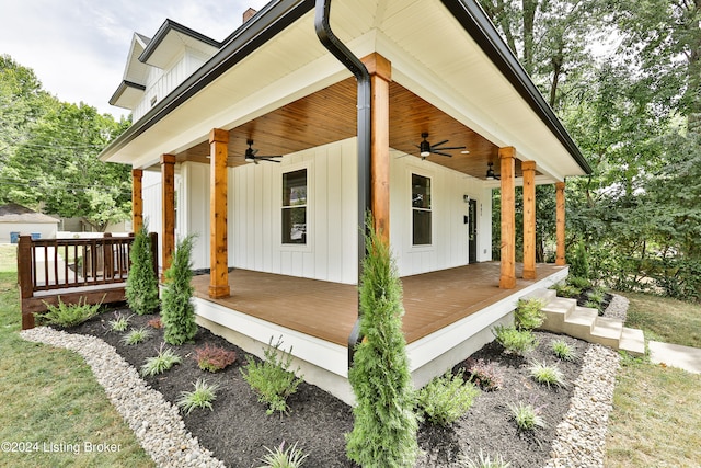 view of side of home with ceiling fan and a porch