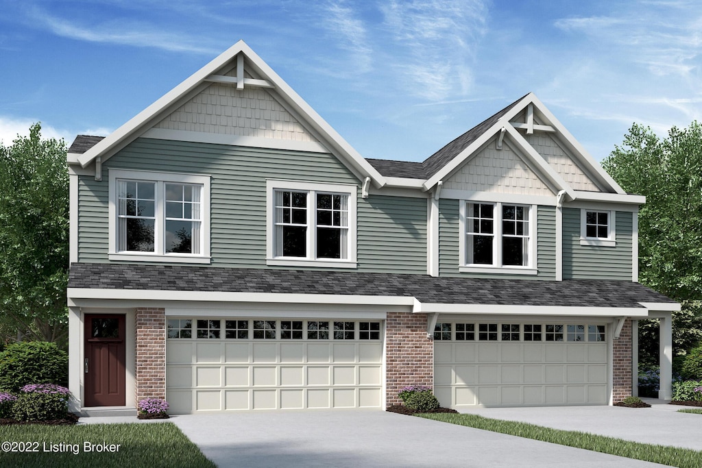 craftsman-style house with concrete driveway, an attached garage, and brick siding