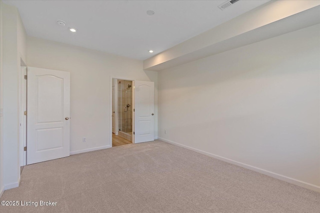 unfurnished bedroom with recessed lighting, light colored carpet, visible vents, and baseboards