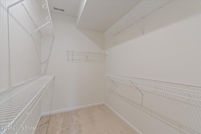 walk in closet with carpet and visible vents