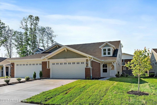 188 Harvest Moon Ct Unit 219B, Shepherdsville, KY 40165 - view of front facade featuring concrete driveway, a garage, a front yard, brick siding, and roof with shingles