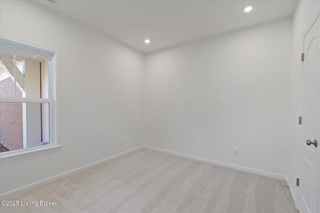 188 Harvest Moon Ct Unit 219B, Shepherdsville, KY 40165 - spare room featuring light carpet, baseboards, and recessed lighting