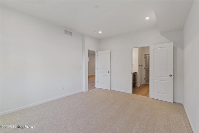 188 Harvest Moon Ct Unit 219B, Shepherdsville, KY 40165 - unfurnished bedroom with light colored carpet, baseboards, recessed lighting, and ensuite bathroom
