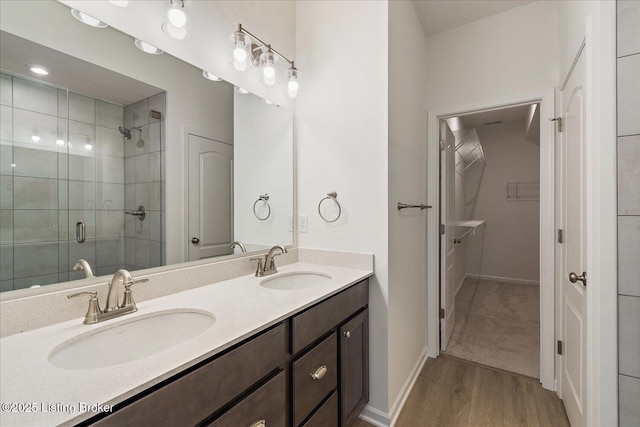 188 Harvest Moon Ct Unit 219B, Shepherdsville, KY 40165 - full bath featuring a shower stall, wood finished floors, a spacious closet, double vanity, and baseboards