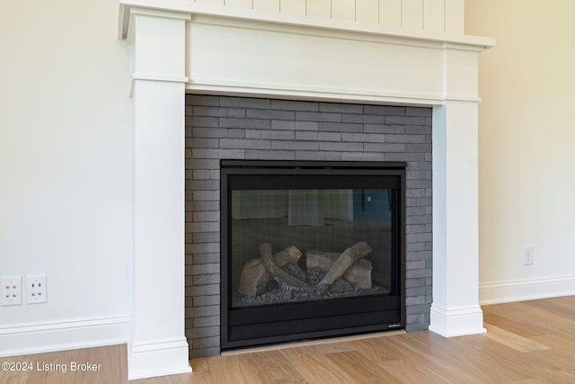 room details featuring hardwood / wood-style floors and a fireplace