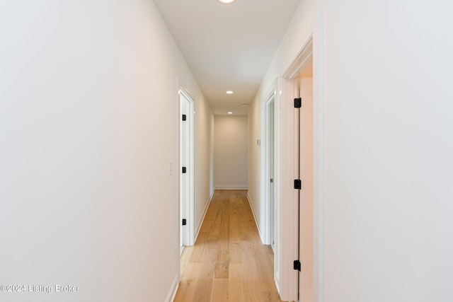 corridor with light wood-type flooring