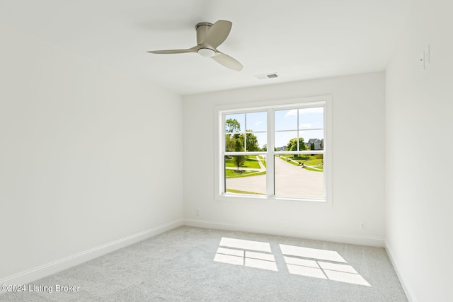 empty room with light carpet and ceiling fan