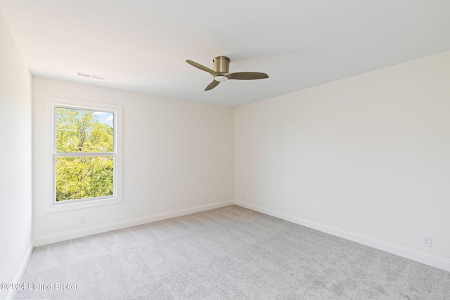 carpeted empty room with ceiling fan