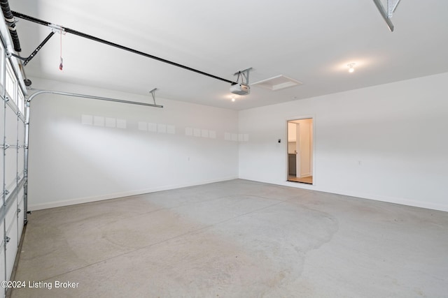 6712 Hypoint Ridge Rd, Crestwood, KY 40014 - garage featuring a garage door opener and baseboards