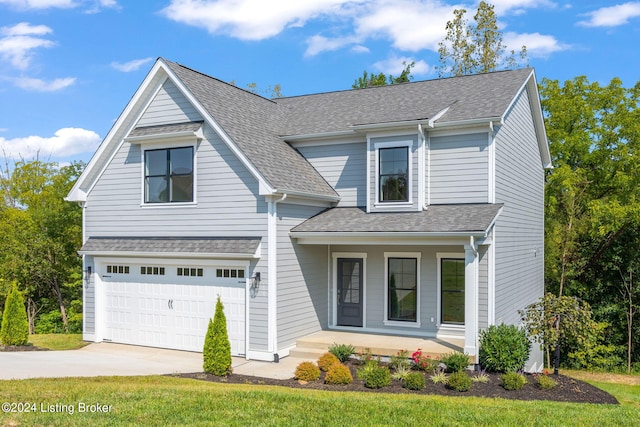 view of front of property with a garage and a porch